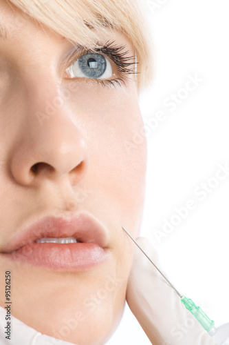woman applying  botox