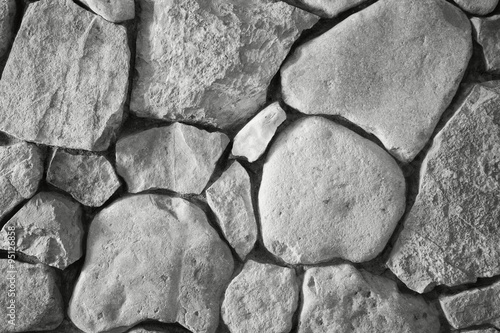 background the wall which is laid out by a stone limestone in black and white #95126858