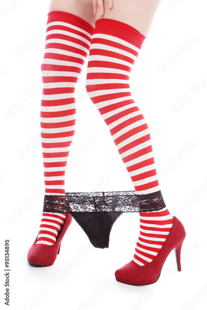 femme avec bas rouge et blanc lignés ôtant son string Stock Photo | Adobe  Stock
