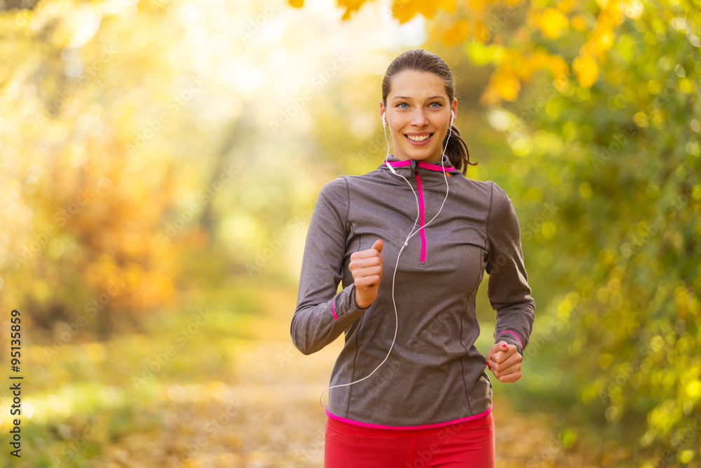 Female fitness model training outside and running. Female fitness model training outside and running.