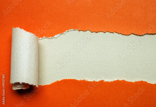 otange Torn paper with white background photo