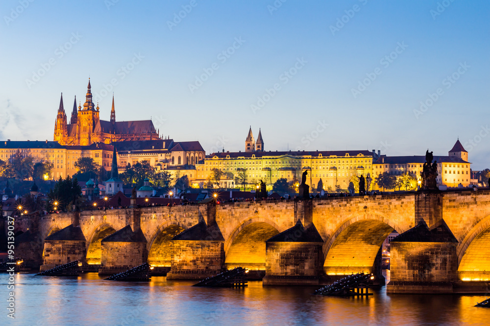 The Prague Castle (built in gothic style) and Charles Bridge are the symbols of Czech capital, built in medieval times. Twilight view of Prague
