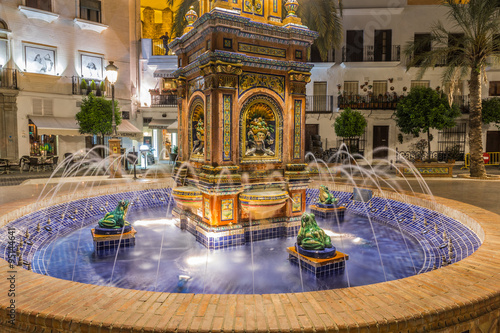 The main square in Vejer de la Frontera, featuring a beautiful fountain with colorful ceramic tiles, Cadiz, Spain
