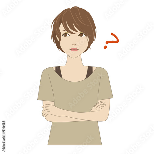 腕を組んで悩む重ね着ファッションの女性