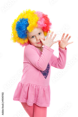 a little girl with clown wig