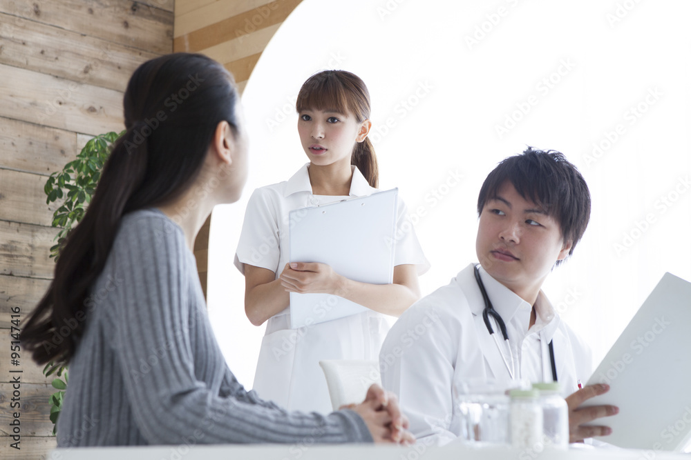 Women undergoing medical examination at a hospital Women undergoing medical examination at a hospital