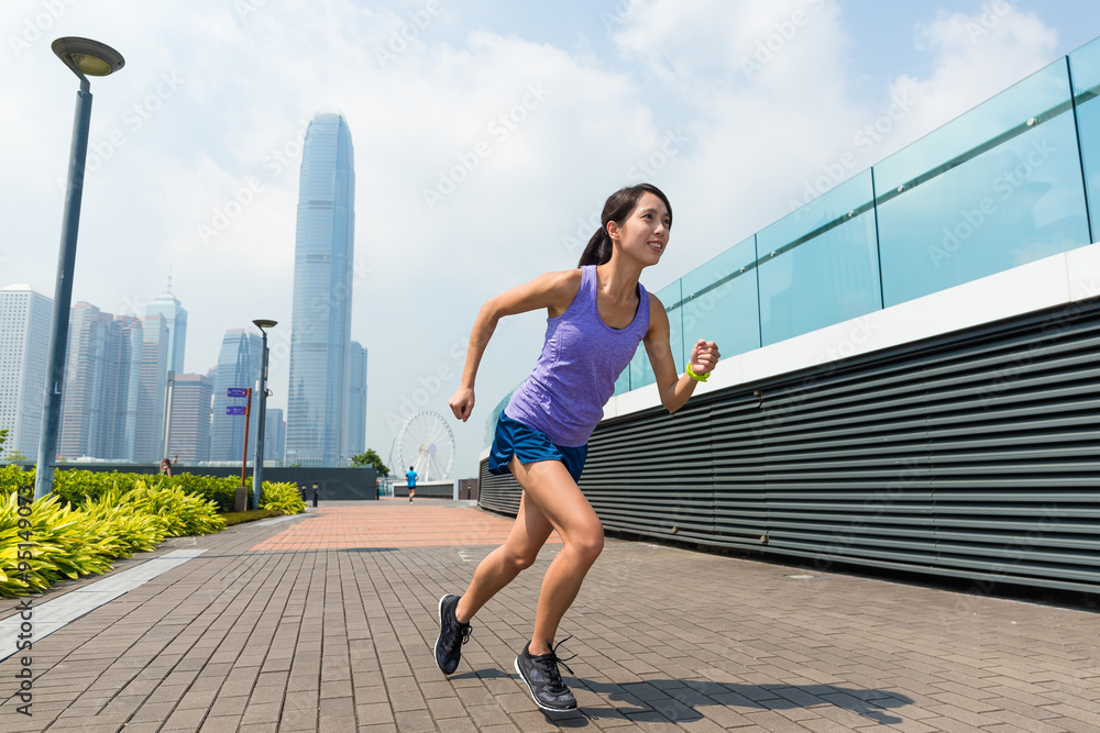 Woman running in Hong Kong city
