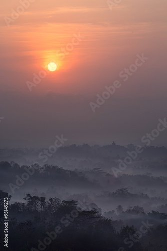 Sun above Borobudur, view from Setumbu hill