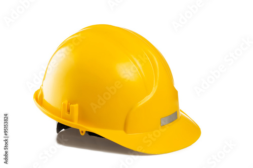 Yellow construction and industrial helmet isolated on white