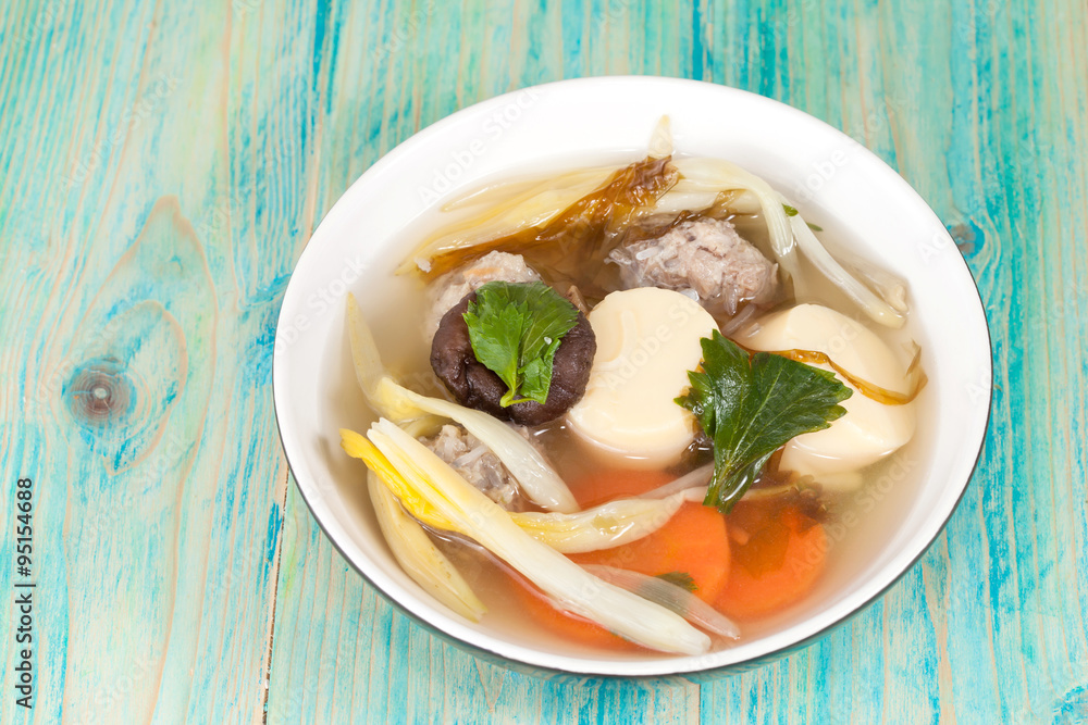Mildly seasoned soup that Consisting of pork, tofu, Mildly seasoned soup that Consisting of pork, tofu,