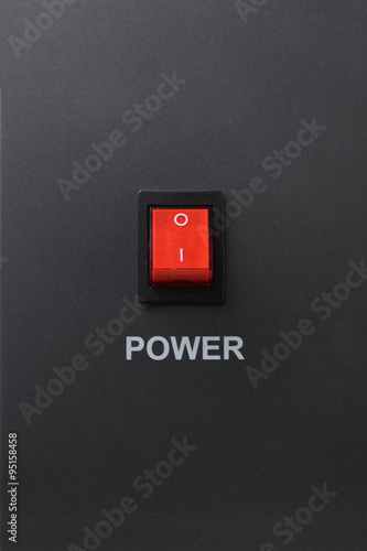 Red power switch in off position with power letter on on metallic color background