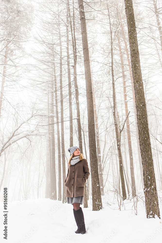 young woman in winter forest  