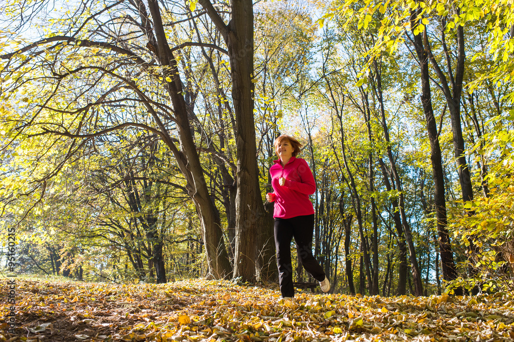Woman running in park Woman running in park