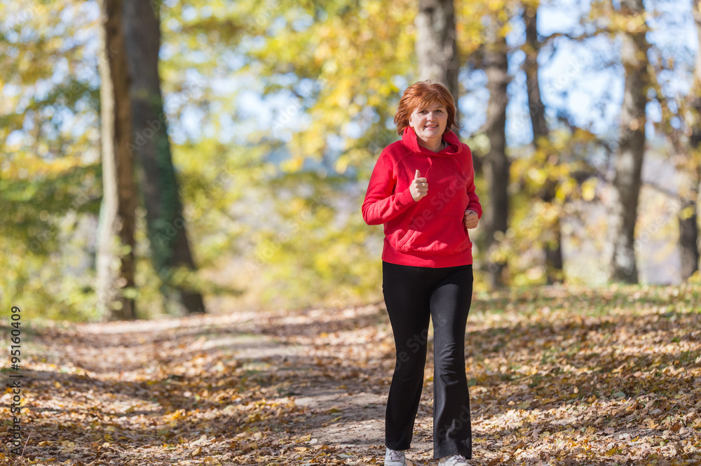 Woman running in park Woman running in park