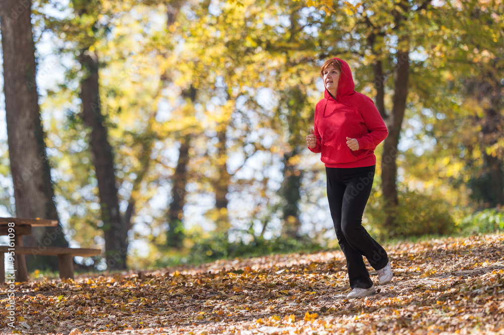Fototapeta premium Woman running in park