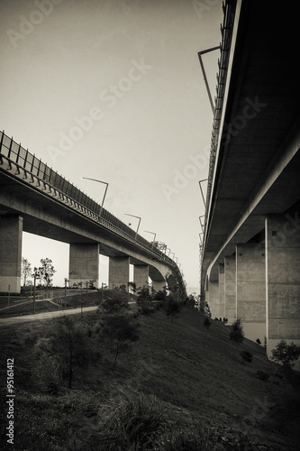 The Gateway Bridge (Sir Leo Hielscher Bridges) at sunset in Brisbane, Queensland, Australia. Abstract black and white image.