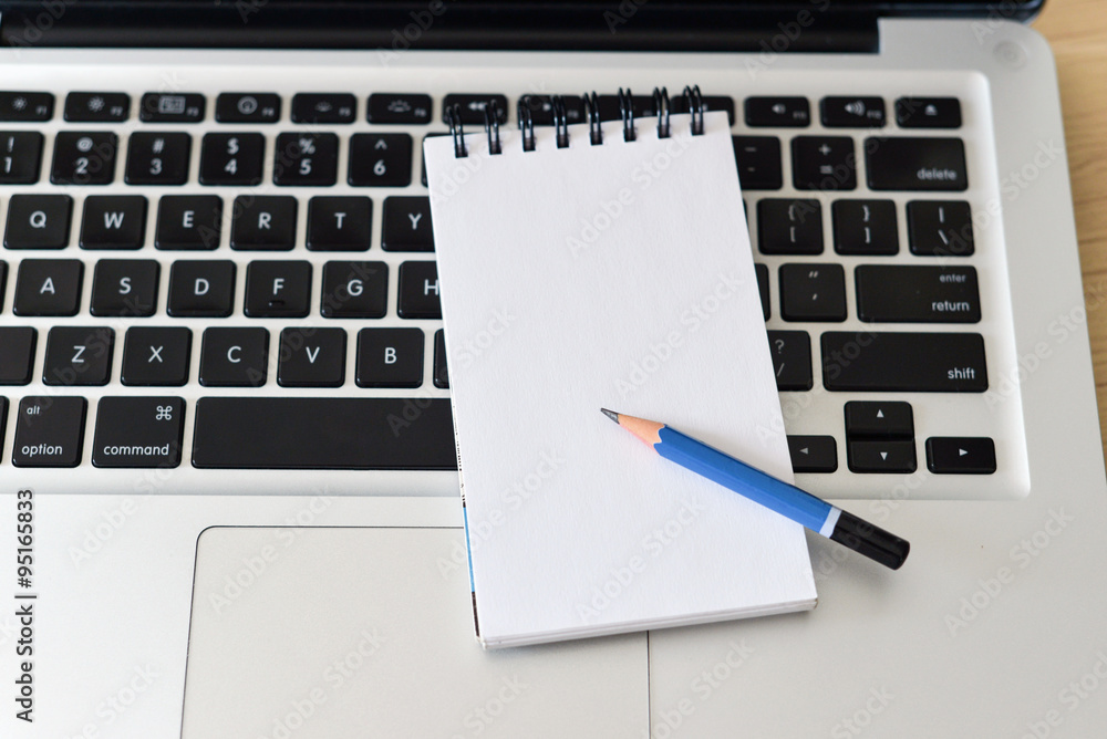 Laptop with pencil and note pad Laptop with pencil and note pad