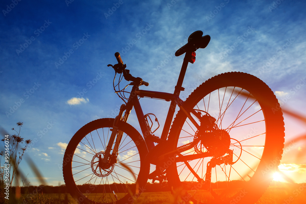 Silhouette of Mountain bicycle at sunset