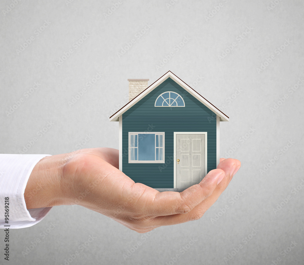 holding house representing home ownership holding house representing home ownership