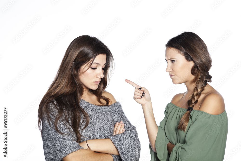 Closeup portrait of woman pointing at her friend because she did something wrong, isolated on white background Closeup portrait of woman pointing at her friend because she did something wrong, isolated on white background