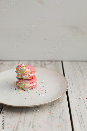 Chocolate Dipped Pink Macaroons with Berries Buttercream and Sprinkles