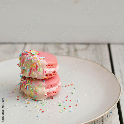 Chocolate Dipped Pink Macaroons with Berries Buttercream and Sprinkles