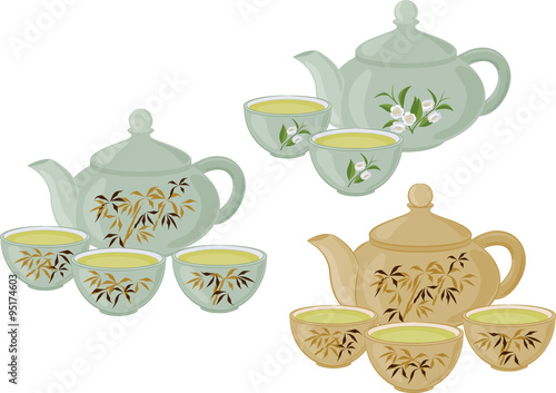 The teapot and small cups of Chinese green tea. Set of isolated objects.