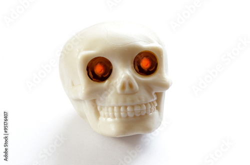 vintage human skull with burning lighted eyes