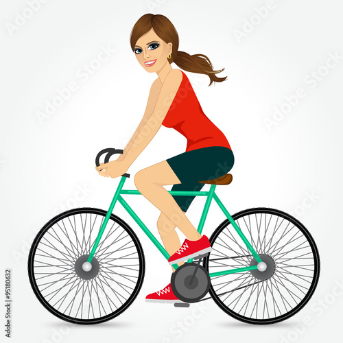 Fototapeta Naklejka Na Ścianę i Meble -  friendly young girl riding bicycle happy 