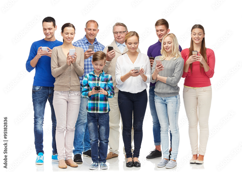 group of smiling people with smartphones