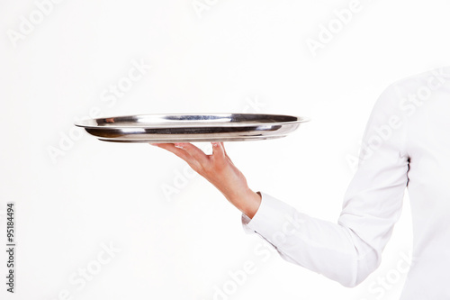 Woman arm in witer uniform holding tray. Over white background.