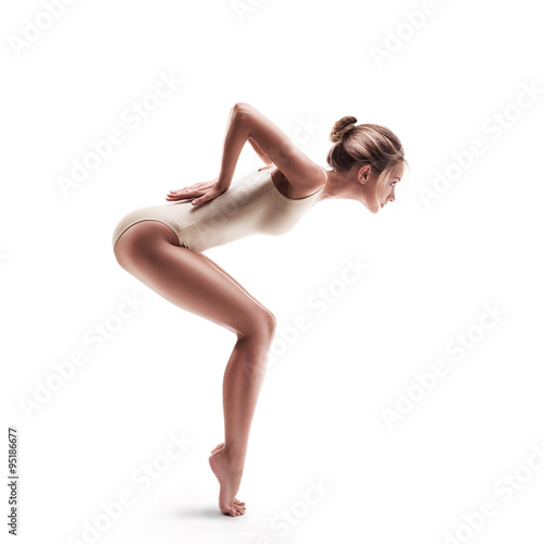 young beautiful dancer in beige swimsuit  © Aleksandr Doodko