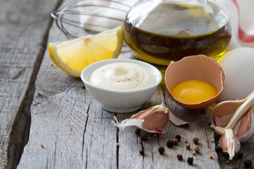 Mayonaise ingredients on rustic wood backgound Mayonaise ingredients on rustic wood backgound