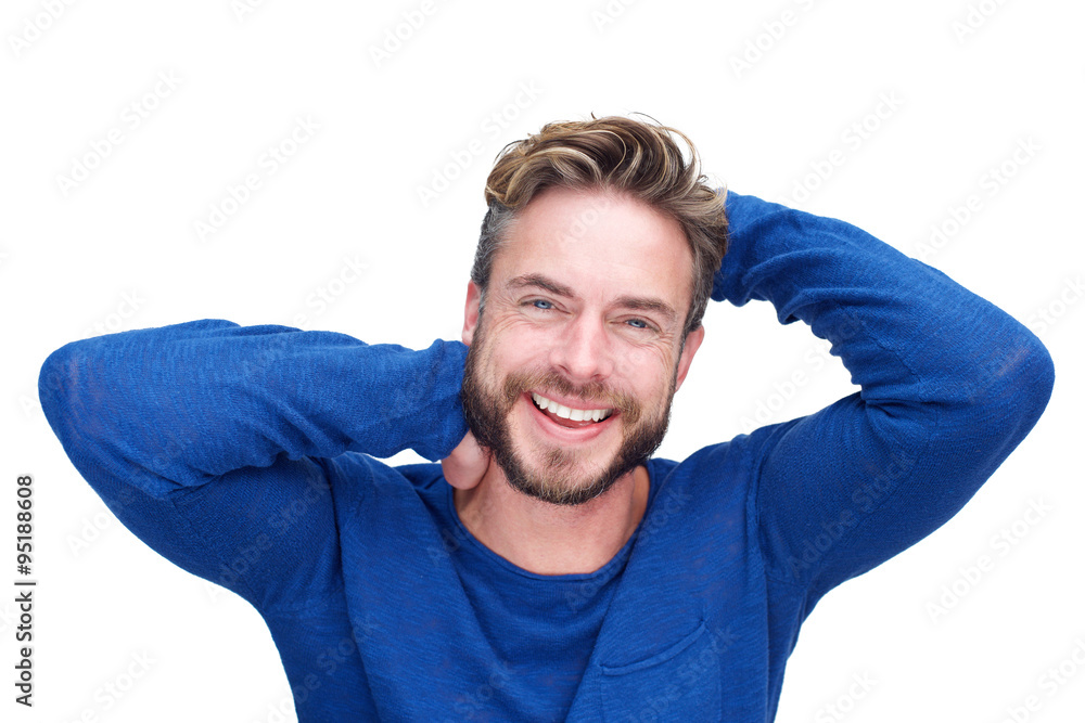 Handsome man with beard laughing with hands in hair Handsome man with beard laughing with hands in hair