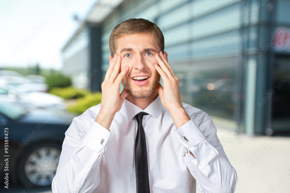 Scared and astonished young businessman Scared and astonished young businessman