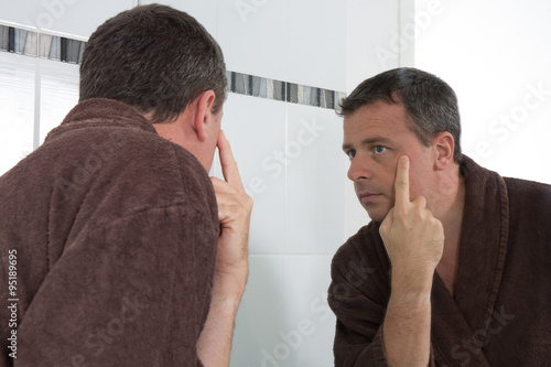 Middle-aged man in bathroom