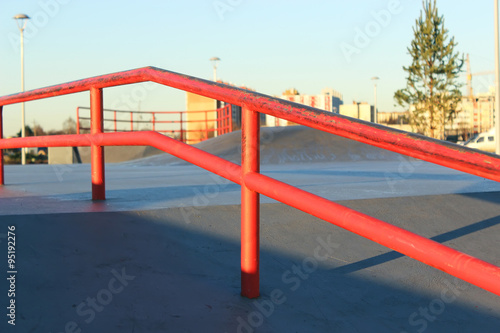 Close up of red skate ramp.