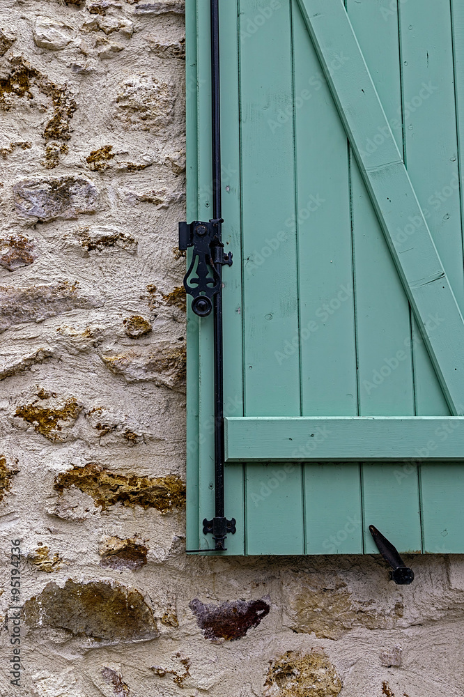 Background facade with wood window painted in green. Background facade with wood window painted in green.