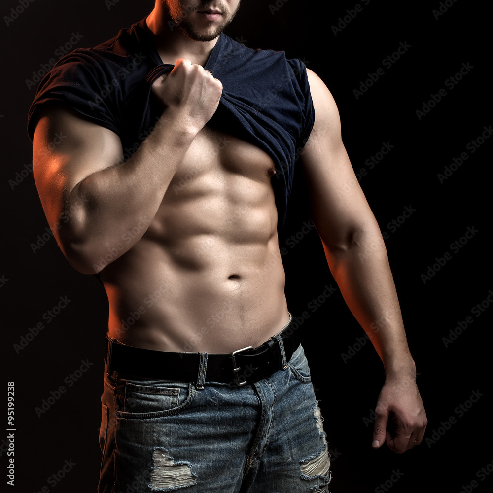 Fototapeta premium Muscular man with shirt on shoulder