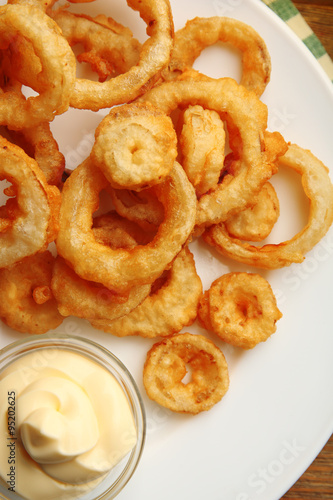 Chips rings with sauce on plate © Africa Studio