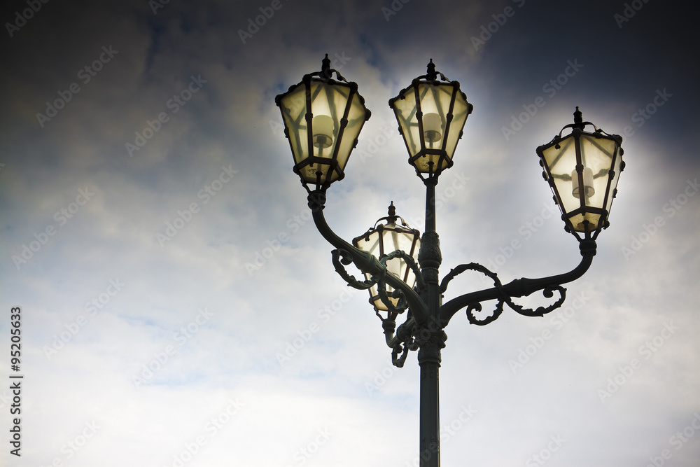 Streetlight of nineteenth century in the middle of a square with copy space