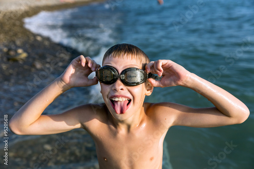 Funny boy shows tongue