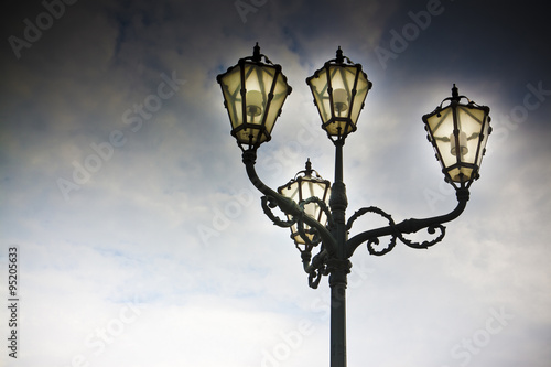 Streetlight of nineteenth century in the middle of a square with copy space