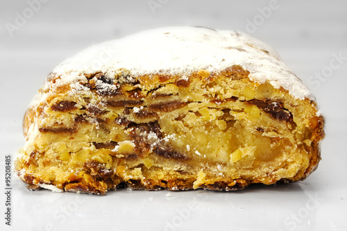 Christmas stollen, traditional German cake on a light gray backg