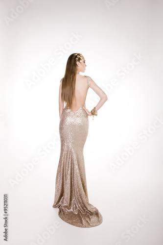 Model in an open back dress