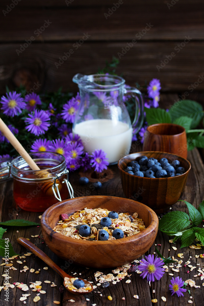 Healthy breakfast of granola with blueberries and nuts and milk. . Healthy breakfast of granola with blueberries and nuts and milk. .