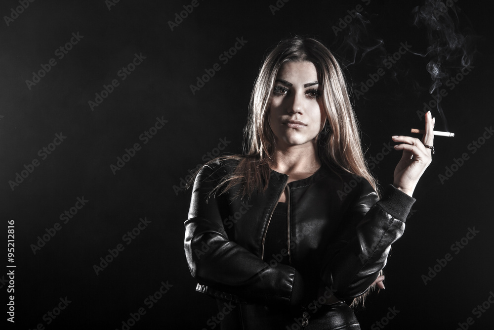 Young woman smoking a cigarette Young woman smoking a cigarette