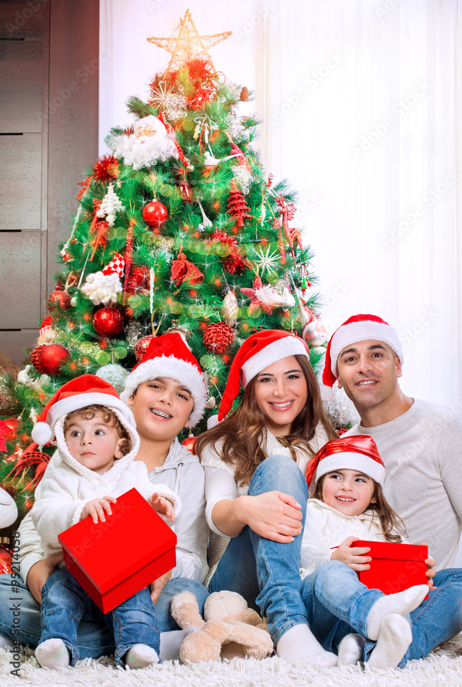 Happy family near Christmas tree
