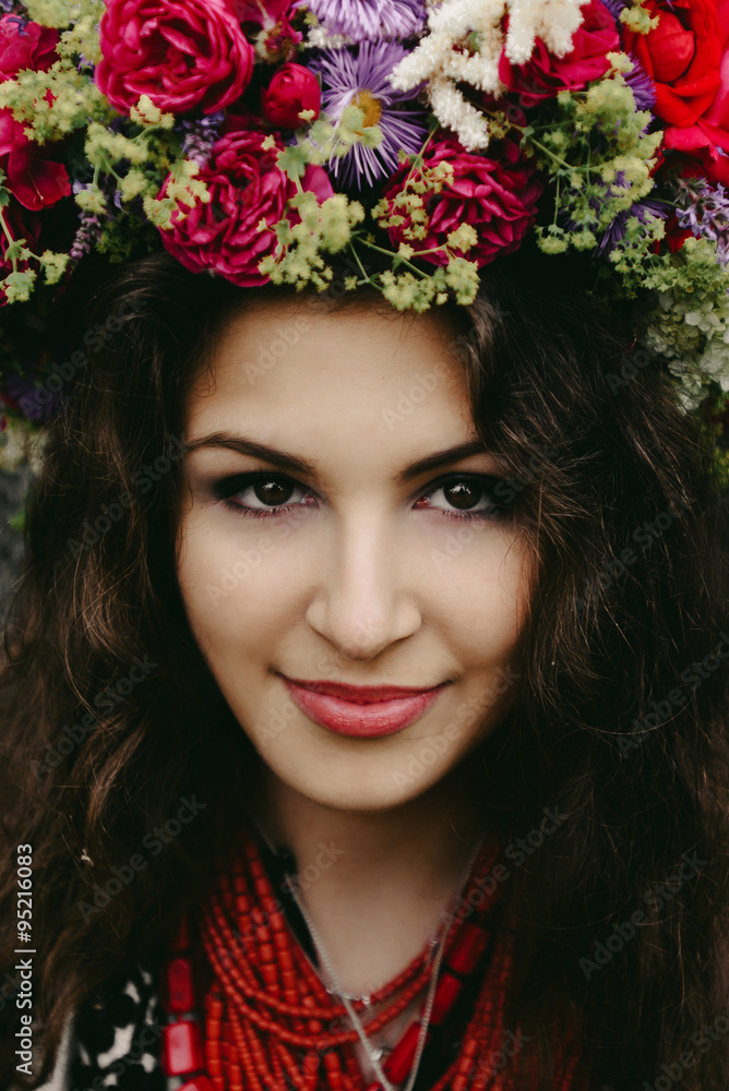 beautiful amazing gorgeous brunette girl with a big flower wreat