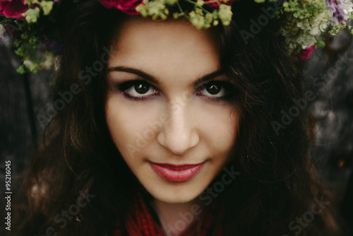 beautiful amazing gorgeous brunette girl with a big flower wreat